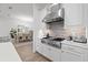 Bright kitchen boasts white cabinets, stainless appliances, and breakfast nook at 11398 Juglans Dr, Odessa, FL 33556