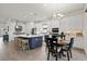 Bright kitchen boasts white cabinets, stainless appliances, and an island with seating at 11398 Juglans Dr, Odessa, FL 33556