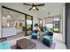 Covered lanai with outdoor seating and view through sliding glass doors to interior at 11398 Juglans Dr, Odessa, FL 33556