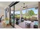 Covered lanai with wicker seating and views of the green backyard, perfect for entertaining at 11398 Juglans Dr, Odessa, FL 33556