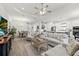 Open living space seamlessly blending the living room, dining area, and modern kitchen at 11398 Juglans Dr, Odessa, FL 33556