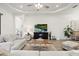 Bright and airy living room with neutral-toned furniture, decorative accents, and recessed lighting at 11398 Juglans Dr, Odessa, FL 33556