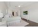 Bright main bedroom with a ceiling fan, large windows, and an attached walk-in closet at 11398 Juglans Dr, Odessa, FL 33556