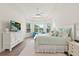 Bright main bedroom with a seating area and large windows overlooking a scenic view at 11398 Juglans Dr, Odessa, FL 33556