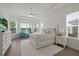 Spacious main bedroom with large windows offering scenic views and a ceiling fan at 11398 Juglans Dr, Odessa, FL 33556