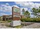 Commercial sign for a shopping center including Publix, TGH Urgent Care, and Pearle Vision at 11398 Juglans Dr, Odessa, FL 33556