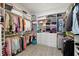 Spacious walk-in closet with custom shelving and storage for organization at 11398 Juglans Dr, Odessa, FL 33556