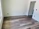 Bedroom features luxury vinyl plank flooring and neutral paint at 11406 Labrador Duck Rd, Weeki Wachee, FL 34614