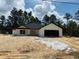 Charming single-story home with a two-car garage and minimalist landscaping at 11406 Labrador Duck Rd, Weeki Wachee, FL 34614