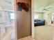 Bathroom is accessible from bedroom and features tile floor, toilet, and full shower at 11619 Boynton Ln, New Port Richey, FL 34654