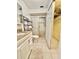 Bathroom with a walk-in shower, a vanity with granite countertop, and neutral tile flooring at 11619 Boynton Ln, New Port Richey, FL 34654