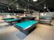 Billiard room in the clubhouse with multiple pool tables at 11619 Boynton Ln, New Port Richey, FL 34654