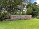 Welcome to Summertree, a lovely community sign surrounded by beautiful, mature trees and manicured landscaping at 11619 Boynton Ln, New Port Richey, FL 34654