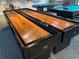 Shuffleboard and billiard tables for friendly competition and entertainment in the community game room at 11619 Boynton Ln, New Port Richey, FL 34654