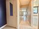 Hallway with tiled flooring providing access to various rooms within the home at 11619 Boynton Ln, New Port Richey, FL 34654