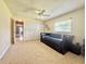 Living room featuring a day bed, closet space, and window at 11619 Boynton Ln, New Port Richey, FL 34654