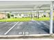 Assigned parking with view of colorful home exteriors, manicured lawns, and welcoming front doors at 11619 Boynton Ln, New Port Richey, FL 34654