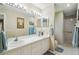 Bathroom featuring double sinks and well-lit vanity at 11752 Wheatfield Loop, Hudson, FL 34667
