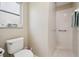 Bright bathroom with a walk-in shower at 11752 Wheatfield Loop, Hudson, FL 34667