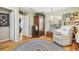 Comfortable bedroom with hard wood floors, chair, and natural light at 11752 Wheatfield Loop, Hudson, FL 34667
