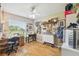 Bright craft room with lots of tables and a sewing machine at 11752 Wheatfield Loop, Hudson, FL 34667