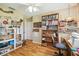 Spacious craft room with sewing station, ample storage, and natural light at 11752 Wheatfield Loop, Hudson, FL 34667