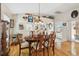 Well-lit dining area with hardwood floors and a view of the backyard patio at 11752 Wheatfield Loop, Hudson, FL 34667