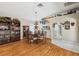Well-lit dining area with hardwood floors and a view of the kitchen at 11752 Wheatfield Loop, Hudson, FL 34667