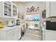 Well-lit kitchen area with a view of the patio and access to outdoor seating at 11752 Wheatfield Loop, Hudson, FL 34667
