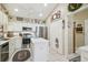 Spacious kitchen with stainless steel appliances, white cabinets, and an island at 11752 Wheatfield Loop, Hudson, FL 34667