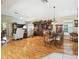 Open-concept living and dining area features hardwood floors and plenty of natural light at 11752 Wheatfield Loop, Hudson, FL 34667