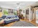 Spacious main bedroom featuring wood floors, natural light, and access to the main bathroom at 11752 Wheatfield Loop, Hudson, FL 34667