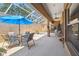 Relaxing covered patio area with furnishings and view of the pool at 11752 Wheatfield Loop, Hudson, FL 34667