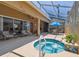 Enclosed pool/spa area with outdoor seating at 11752 Wheatfield Loop, Hudson, FL 34667