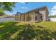 Lush backyard featuring a screen enclosed patio at 12055 Colony Lakes Blvd, New Port Richey, FL 34654