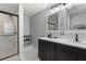 Modern bathroom featuring a marble walk-in shower, gray walls, and and sinks at 12055 Colony Lakes Blvd, New Port Richey, FL 34654