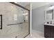 Elegant bathroom featuring a glass shower, marble tile, and modern fixtures at 12055 Colony Lakes Blvd, New Port Richey, FL 34654
