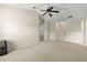 Spacious bonus room with neutral walls, plush carpeting, and a ceiling fan at 12055 Colony Lakes Blvd, New Port Richey, FL 34654