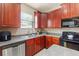 A kitchen featuring an island, stainless steel appliances, and lots of cabinet storage at 12055 Colony Lakes Blvd, New Port Richey, FL 34654