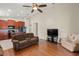 Open floor plan with kitchen and living room with ceiling fan and tile floors at 12055 Colony Lakes Blvd, New Port Richey, FL 34654