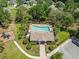 Aerial view of a community pool surrounded by lush landscaping and ample parking at 12055 Colony Lakes Blvd, New Port Richey, FL 34654