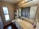 Standard bathroom featuring a single sink vanity, a toilet, and a shower/tub combo with a striped curtain at 12090 Stoneville Ct, Spring Hill, FL 34609
