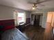 Bedroom with two tone walls, ceiling fan, and large closet at 12090 Stoneville Ct, Spring Hill, FL 34609