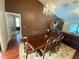 Elegant dining room with a chandelier and a spacious dining table and chairs at 12090 Stoneville Ct, Spring Hill, FL 34609
