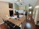 Well-lit kitchen with a breakfast bar, modern appliances, and ample countertop space at 12090 Stoneville Ct, Spring Hill, FL 34609