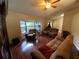 Spacious living room with large windows and comfortable seating area at 12090 Stoneville Ct, Spring Hill, FL 34609