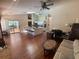 Expansive open-concept living area with kitchen island and access to an outdoor patio at 12090 Stoneville Ct, Spring Hill, FL 34609