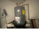 Water heater with visible connections and labeling, in a utility area of the home at 12090 Stoneville Ct, Spring Hill, FL 34609