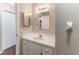 Bathroom featuring a vanity with a mirror, drawers, and a doorway leading to another room at 12155 Environmental Dr # 8, New Port Richey, FL 34654