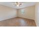 Spacious bedroom featuring wood-look flooring, neutral walls, and a ceiling fan with an overhead light fixture at 12155 Environmental Dr # 8, New Port Richey, FL 34654